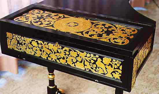 The case of the 1702 Grimaldi harpsichord, with lid closed, showing the silver leaf decoration technique