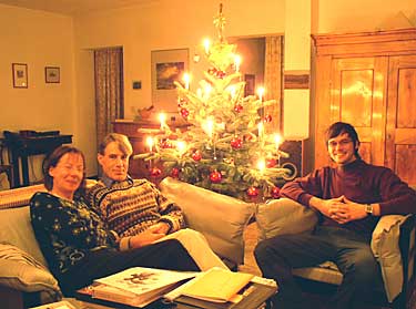 Photo of my wife Claudia and son Philipp by chistmas tree candlelight in 2003. (I'm in the middle)
